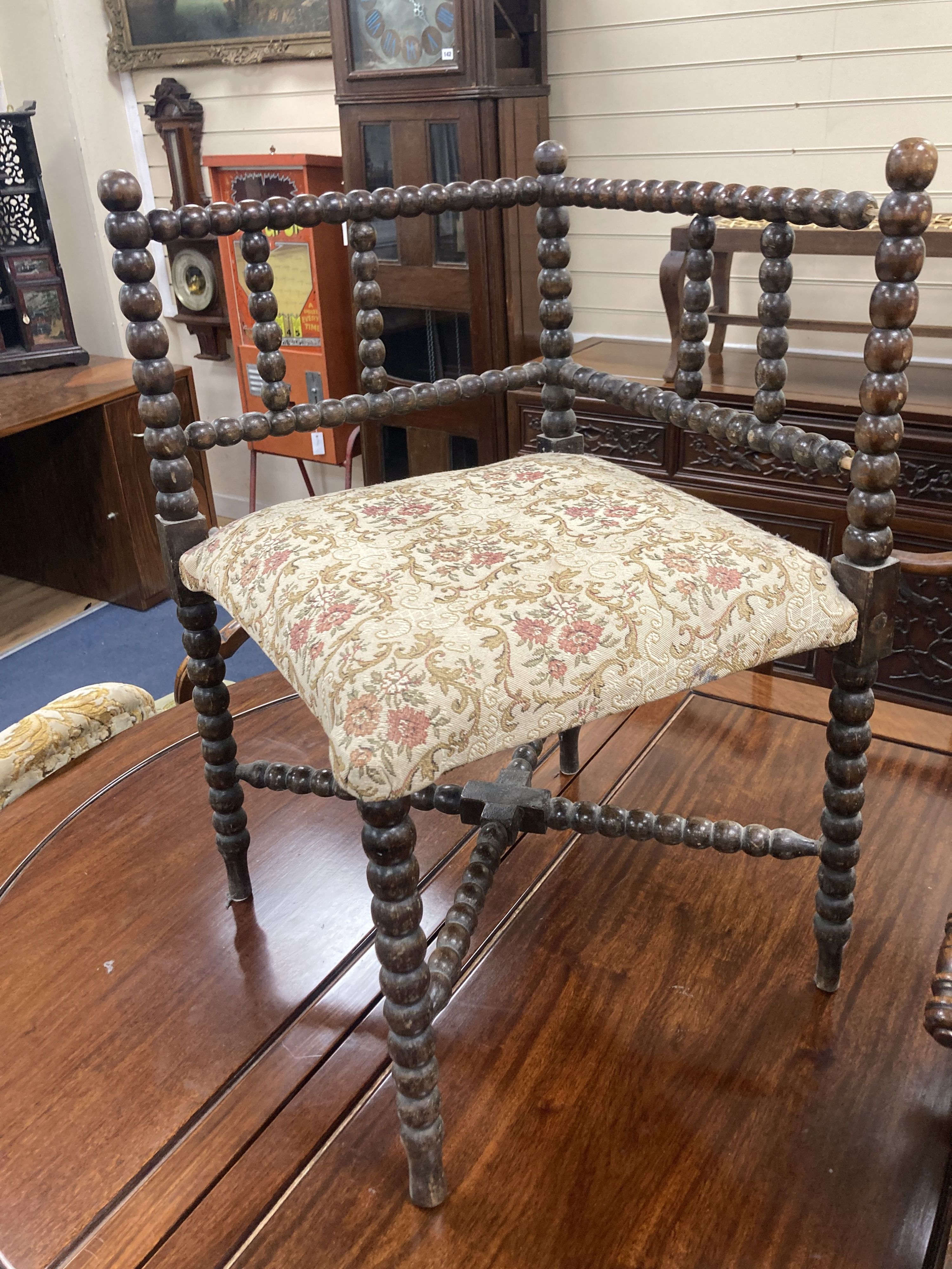 A Victorian childs rocking chair, width 33cm, depth 47cm, height 74cm together with a Victorian bobbin turned corner armchair, width 5